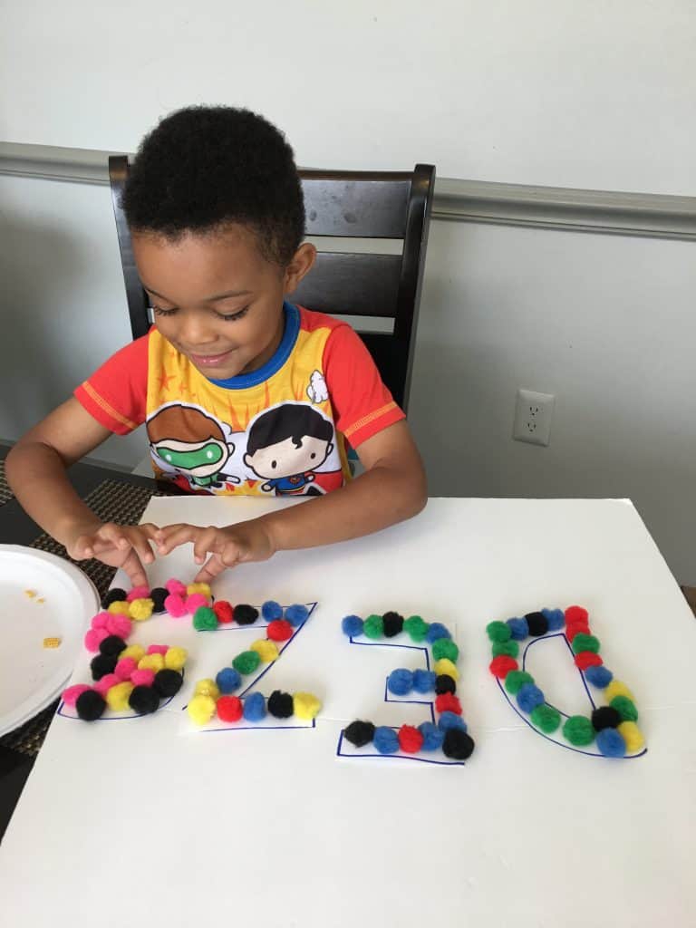 How to Make an Outdoor Easel - Busy Toddler