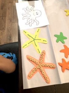 Starting Early With Toddler Fine Motor Skills Activities Is An Absolute Must! This Star Fish Decorating Craft Is A Super Easy Way To Practice Those Fine Motor Skills That Can Help With Development.