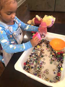 Looking for an Awesome Sensory Activity for Toddlers? Well This Bean Sensory Activity Is An Absolute Must! This Bead Sensory Bin Activity Is A Super Easy Way To Have Tons of Fun.