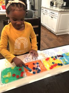 Sensory Activities For Toddlers Are An Absolute Must For Early Development Through Play And Good Plain Fun! This Easy Pom Pom Sensory Bag Is Super Easy and Cool. Great Sensory Bags for Babies Too!