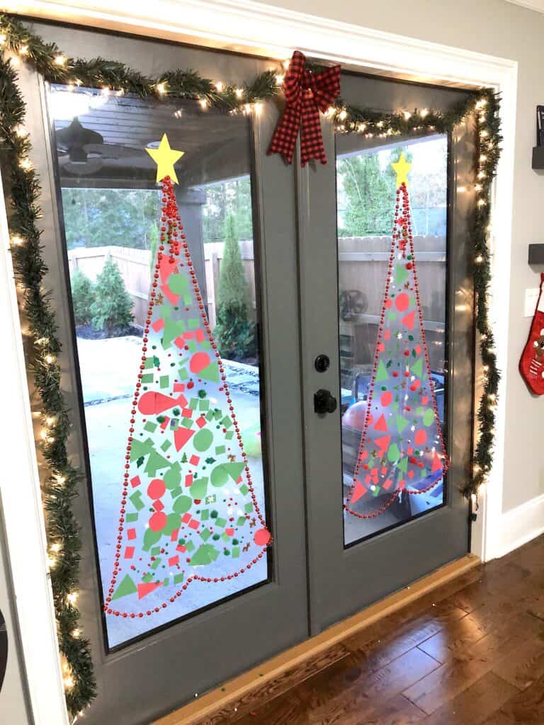 This Christmas Tree Craft For Kids Will Be A Hit For The Holidays! This Activity Uses Contact Paper To Create A Fun And Unique Christmas Craft Experience. #christmascrafts #christmascraftsforkids