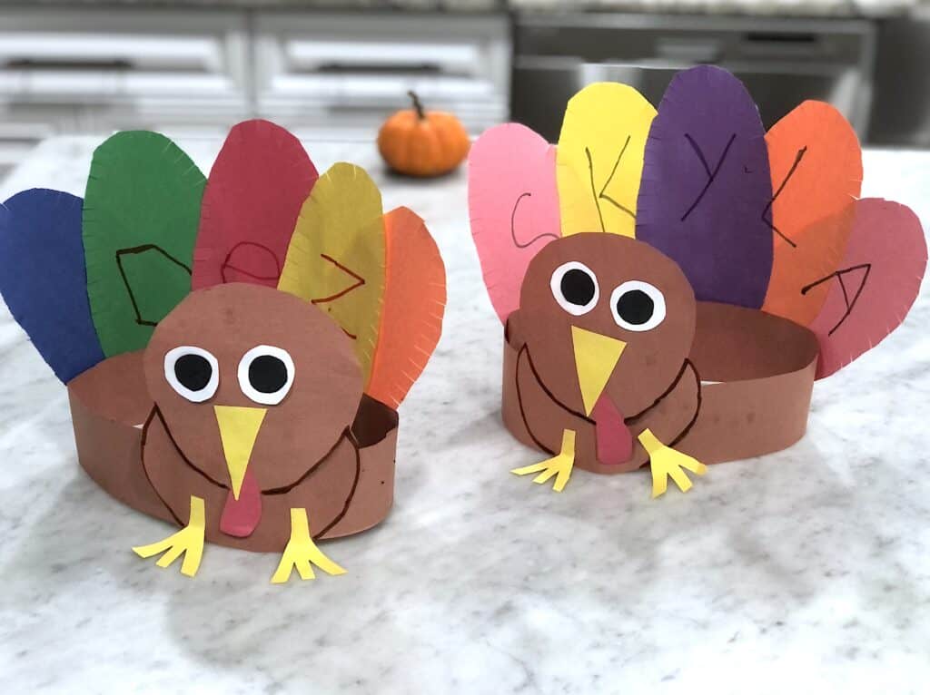 This Adorable Thanksgiving Turkey Craft Will Be A Hit With The Kids! This Cool Turkey Hat with Name Recognition Activity Inspires Just Plain Fun and Learning. Let Your Kids Wear Them on Thanksgiving!