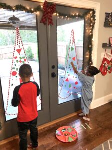This Christmas Tree Craft For Kids Will Be A Hit For The Holidays! This Activity Uses Contact Paper To Create A Fun And Unique Christmas Craft Experience. #christmascrafts #christmascraftsforkids