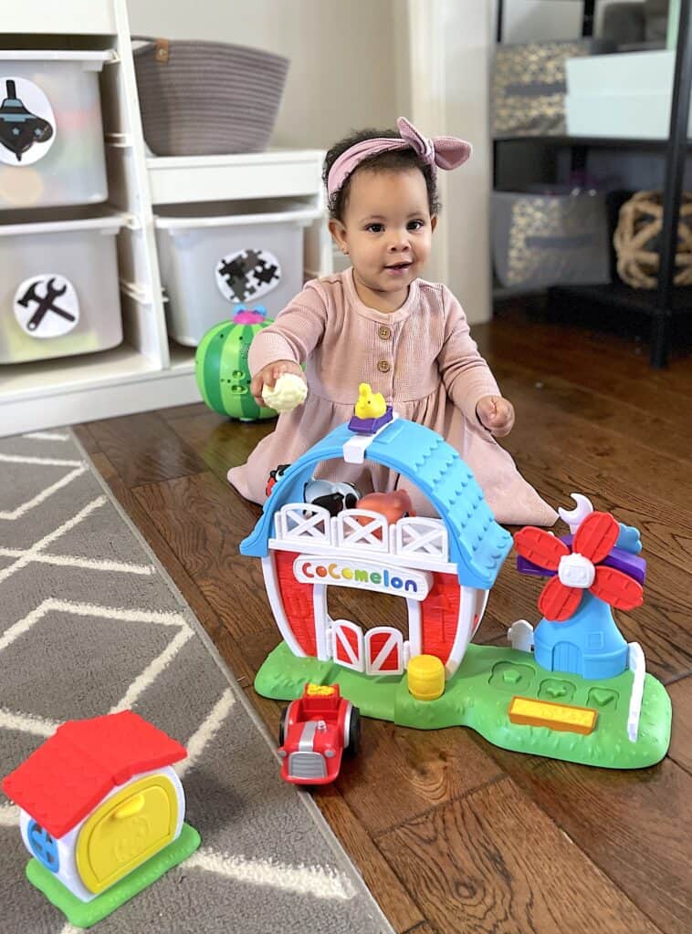 kinsley playing with the farm