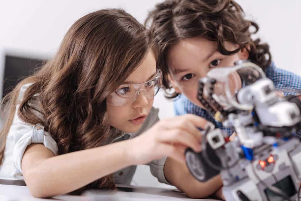 Inventive kids enjoying science lesson at school