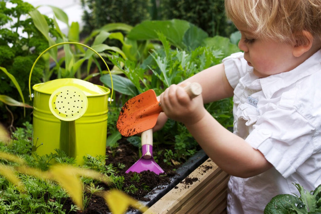 kids planting flower window