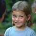 Young child being introduced to a new daycare group – A teacher helping them feel comfortable